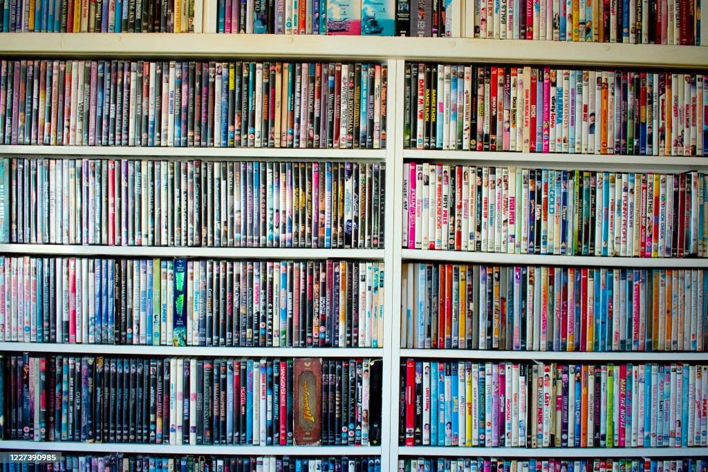 Mystery box of 50+ DVDs—inspected & playable—many genres—free shipping (GA-2)